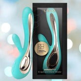 The LELO Soraya 2 Aqua - Waterproof Wireless Rabbit Vibrator by LELO is displayed in teal and gold next to its black packaging, which features a clear window showing the dual action vibrator inside.
